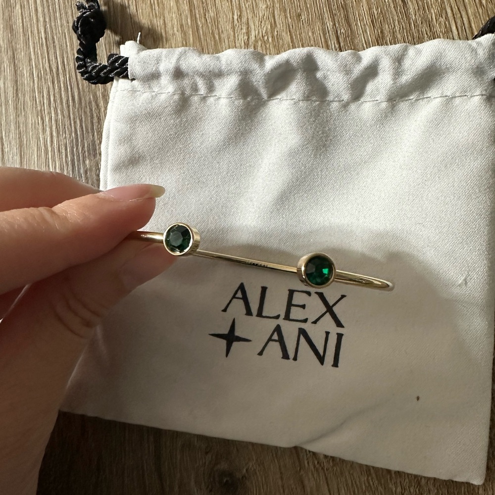 Alex and Ani Gold cuff with emerald Stones